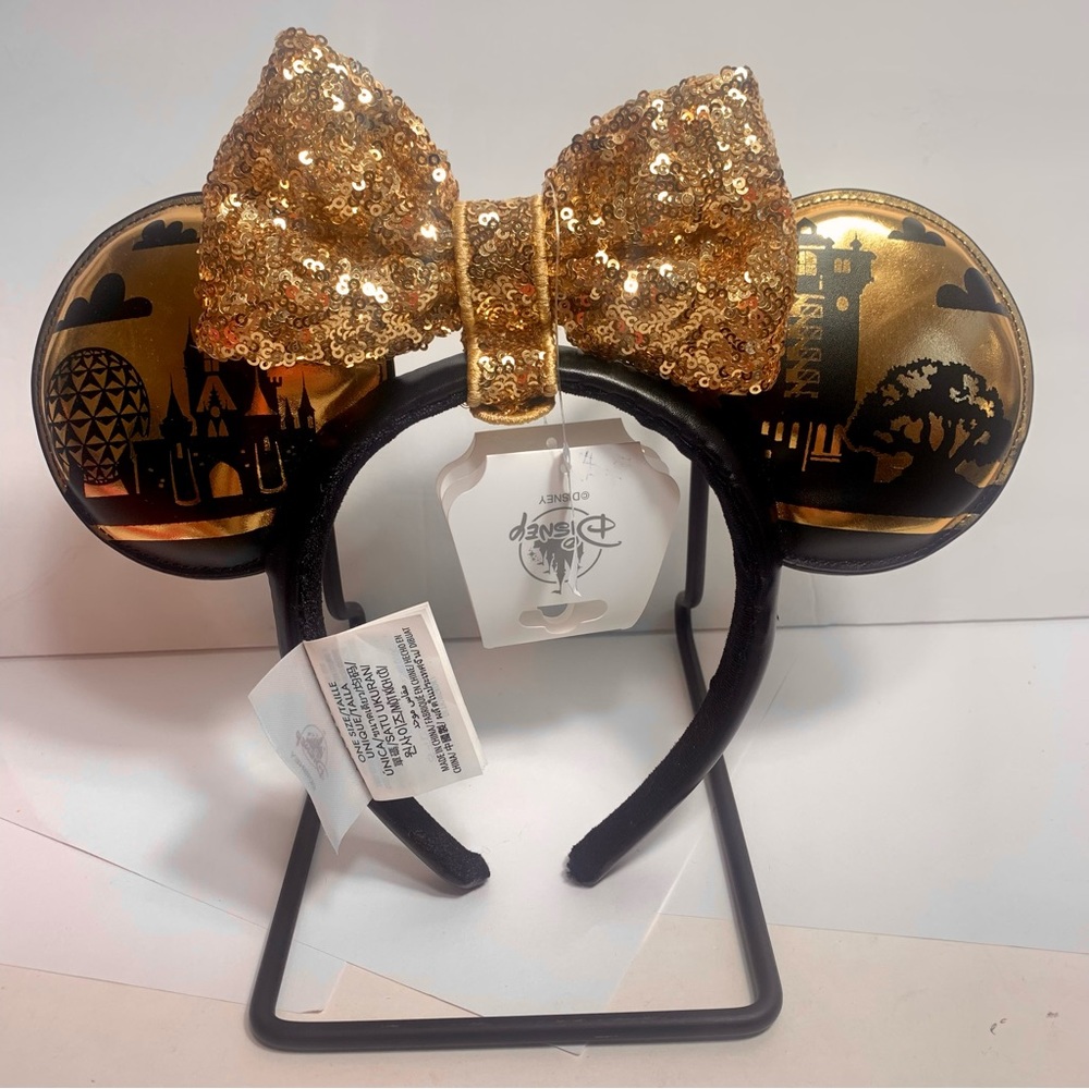 NWT. Disney Park Icons Ear Headband with Removable gold sequin Bow.